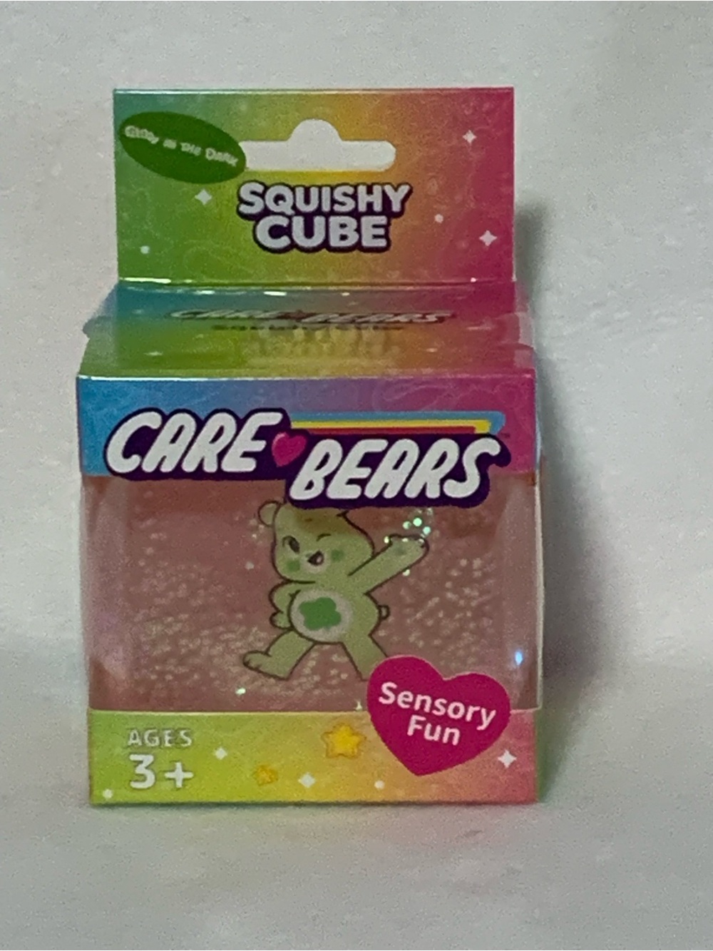 Care Bears Squishy Cube Packaging with Rainbow, Pink, Green and Blue Accents